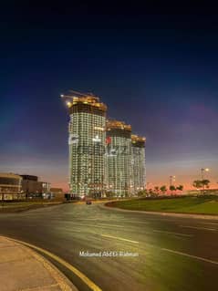 For sale, a 150 sqm apartment, fully finished + ACs, in Al Alamein Towers, North Coast, with a 15% down payment
