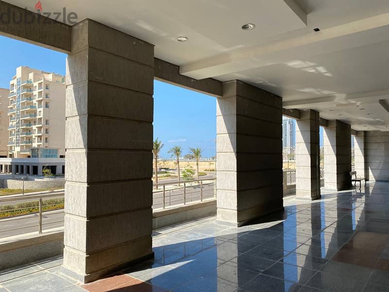 An investment commercial store of 72 meters with facilities in Downtown, New Alamein City, with a view of Al Alamein Towers and Lagoon, at the highest 5