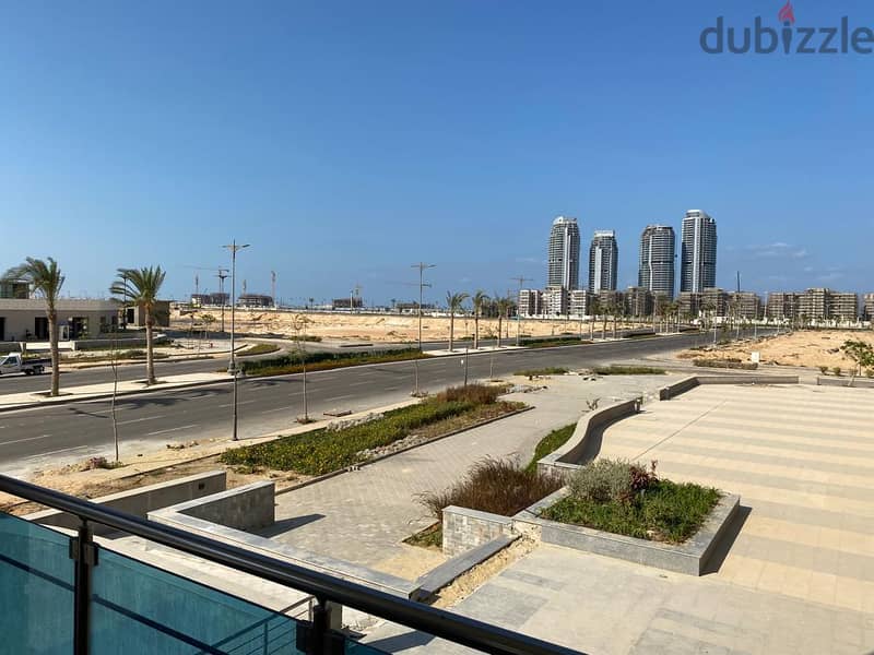 An investment commercial store of 72 meters with facilities in Downtown, New Alamein City, with a view of Al Alamein Towers and Lagoon, at the highest 6