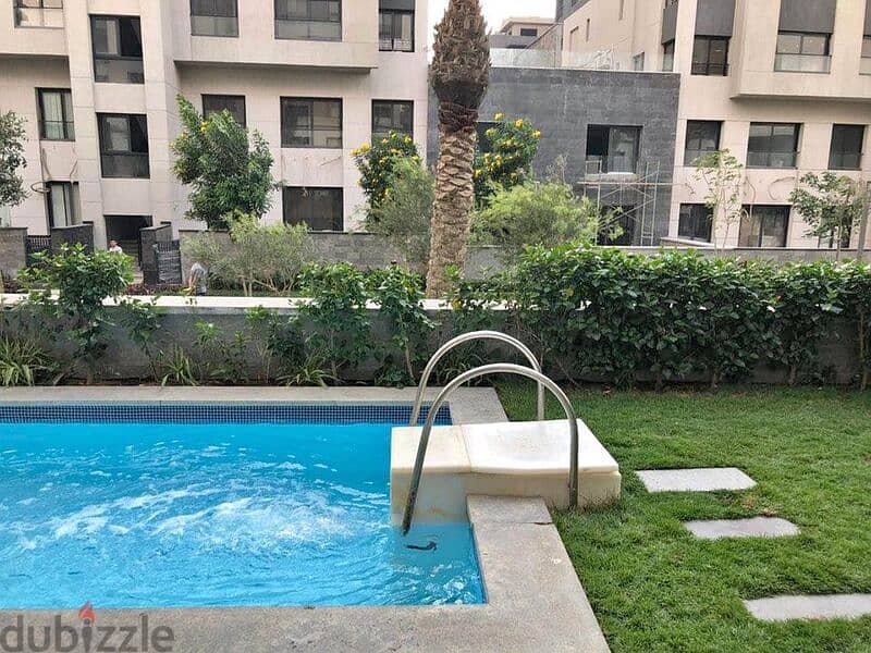 Apartment with garden for sale with the most beautiful view in Fifth Settlement, Trio Gardens Compound 1