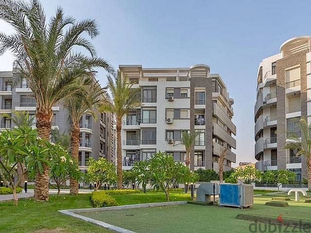 a garden apartment For sale in Fifth Settlement, Hyde Park, next to Emaar Misr Mivida in Golden Square after AUC Pool View 1