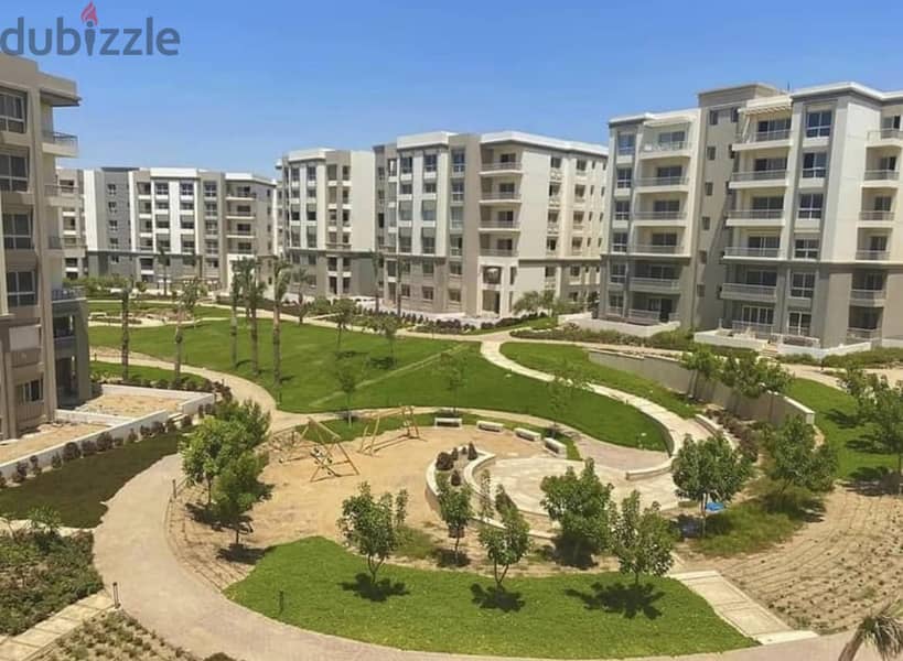 a garden apartment For sale in Fifth Settlement, Hyde Park, next to Emaar Misr Mivida in Golden Square after AUC Pool View 3