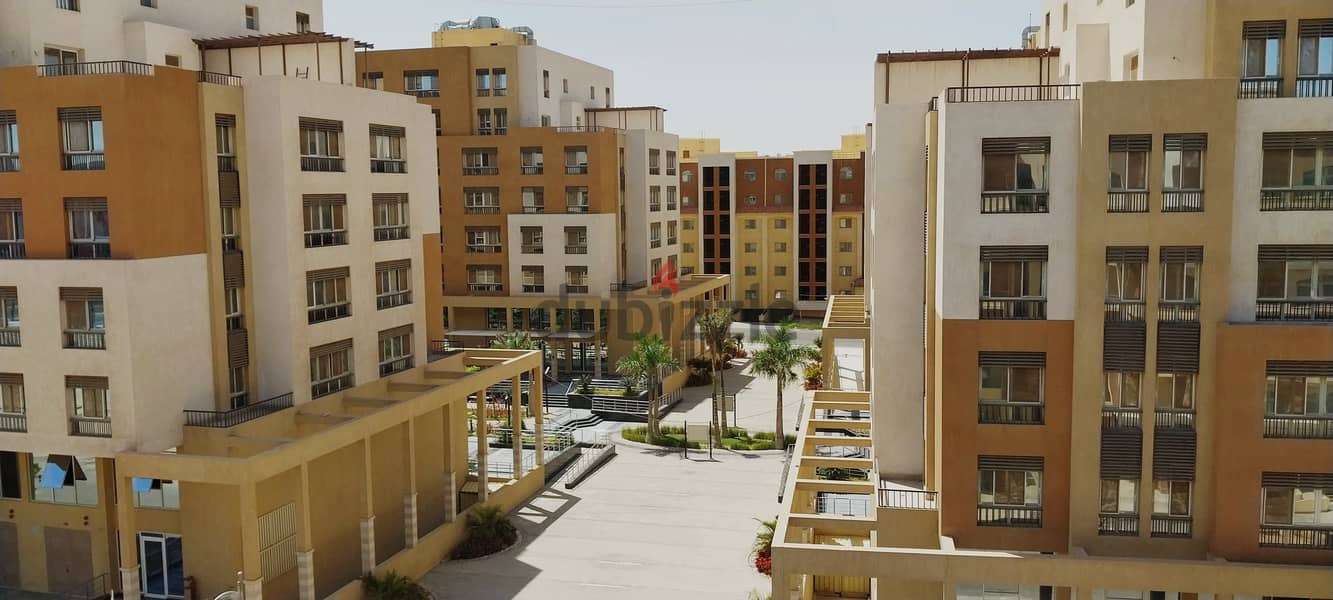 ready to move apartment 144 sqm finished with kitchen and air conditioners in a location in Al Maqsad a view of an iconic tower next to madinaty o 6