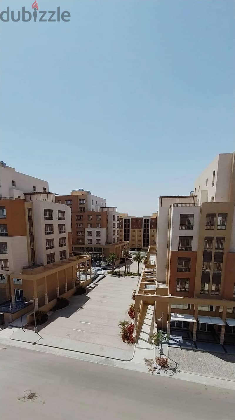 ready to move apartment 144 sqm finished with kitchen and air conditioners in a location in Al Maqsad a view of an iconic tower next to madinaty o 7