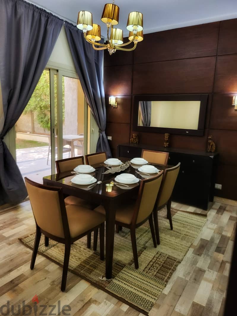 Fully-furnished apartment 146 m. + 100 m. garden for rent ultra super lux in prime location The Village Fifth Settlement New Cairo 5