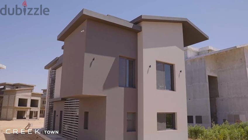Townhouse villa to be received within months for sale in installments in Creek Town Compound, New Cairo 1
