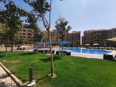 Ground Apartment For Sale At 90 Avenue New Cairo Fully Finished Over Looking landscape and Swimming pool