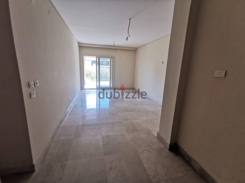 Ground Apartment For Sale At 90 Avenue New Cairo Fully Finished Over Looking landscape and Swimming pool 4