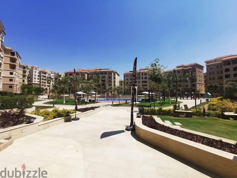 Ground Apartment For Sale At 90 Avenue New Cairo Fully Finished Over Looking landscape and Swimming pool 7