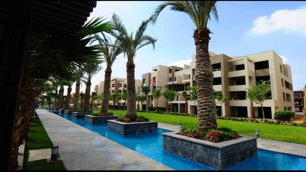 Apartment for sale in the heart of the community in Swan Lake Hassan Allam Compound, directly on Suez Road 1