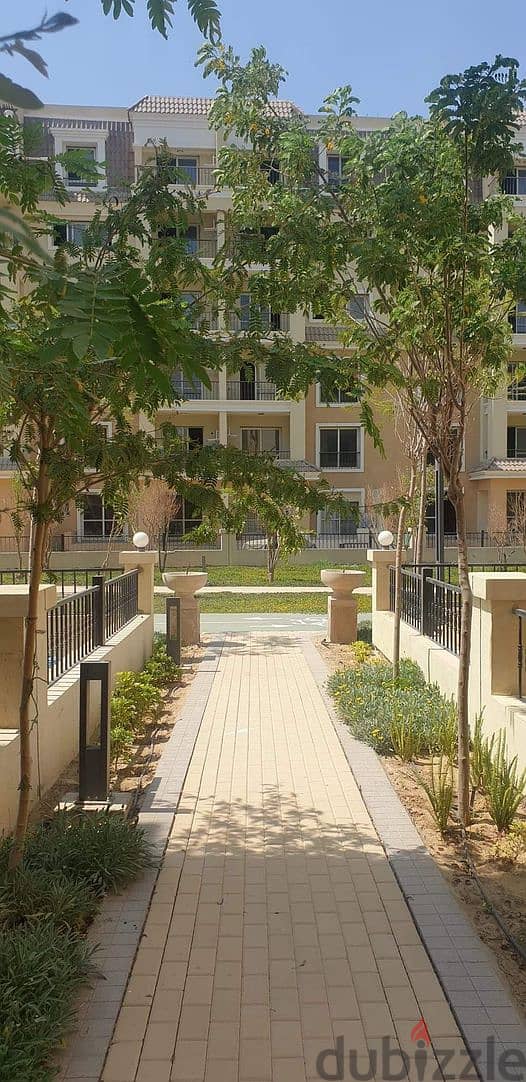 For sale next to Al-Shorouk, apartment 112 m + terrace on view and landscape in Sarai New Cairo, installments for 8 years 6