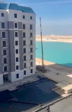 For sale, 228 sqm apartment, nautical, immediate delivery, fully finished, in Alamein, with a view on the Lagoon in New Alamein