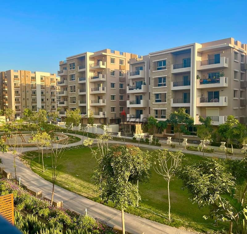 Ground floor apartment with a very special garden view for sale in Taj City Compound in front of Cairo International Airport near Heliopolis 1
