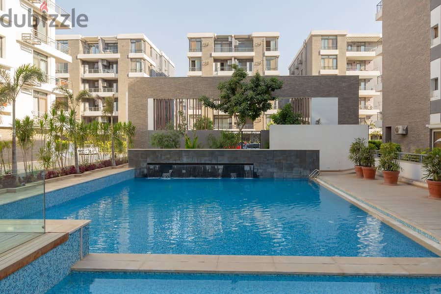 Ground floor apartment with a very special garden view for sale in Taj City Compound in front of Cairo International Airport near Heliopolis 7