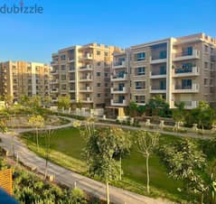 Ground floor apartment with garden for sale in Taj City Direct Compound on Suez Road in front of Kempinski Hotel 0