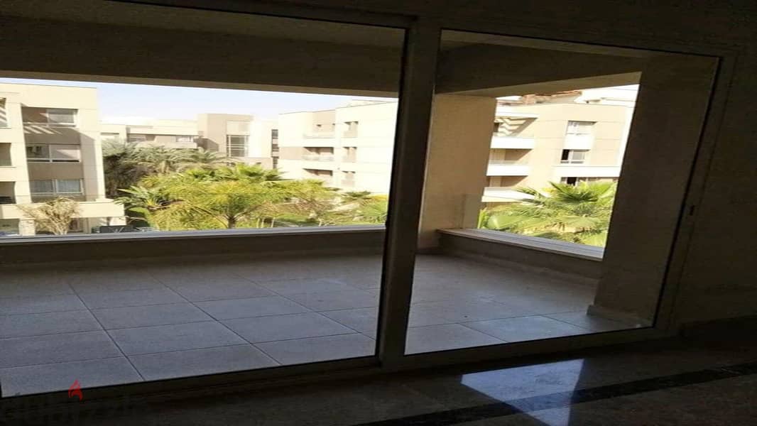 Apartment for sale in the heart of the community in Swan Lake Hassan Allam Compound, directly on Suez Road 2