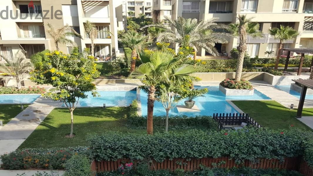 Apartment for sale in the heart of the community in Swan Lake Hassan Allam Compound, directly on Suez Road 6