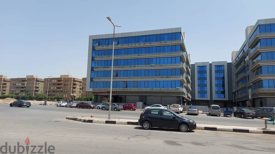 A store directly on the front of the mall for sale in Nasr City, next to Mostafa Al-Nahhas Street and Al-Ahly Club, immediate delivery and installment 12