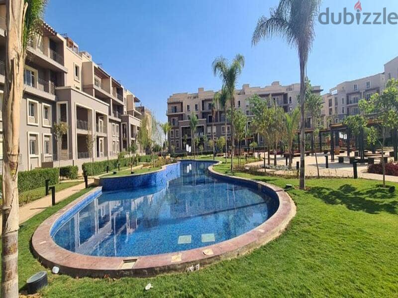 Prime location  For sale Apartment with private garden in October plaza    bua : 179 m 4
