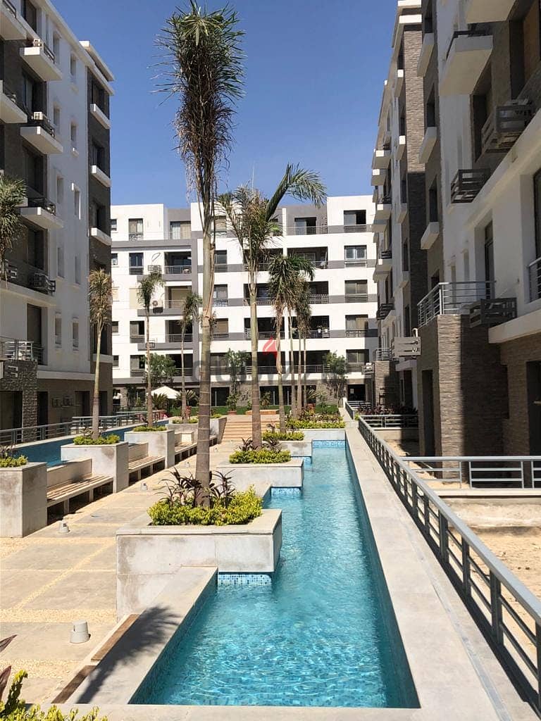Two-bedroom apartment at a very special price in Taj City Compound, area of 114 square meters, recurring floor, on View Direct, with a 5% down payment 1