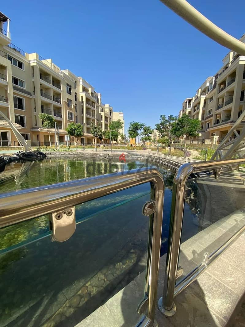 For sale, a 73 sqm studio with a 60 sqm garden, a distinctive division on a landscaped view, in Sarai Compound, New Cairo, with a down payment of 450 6