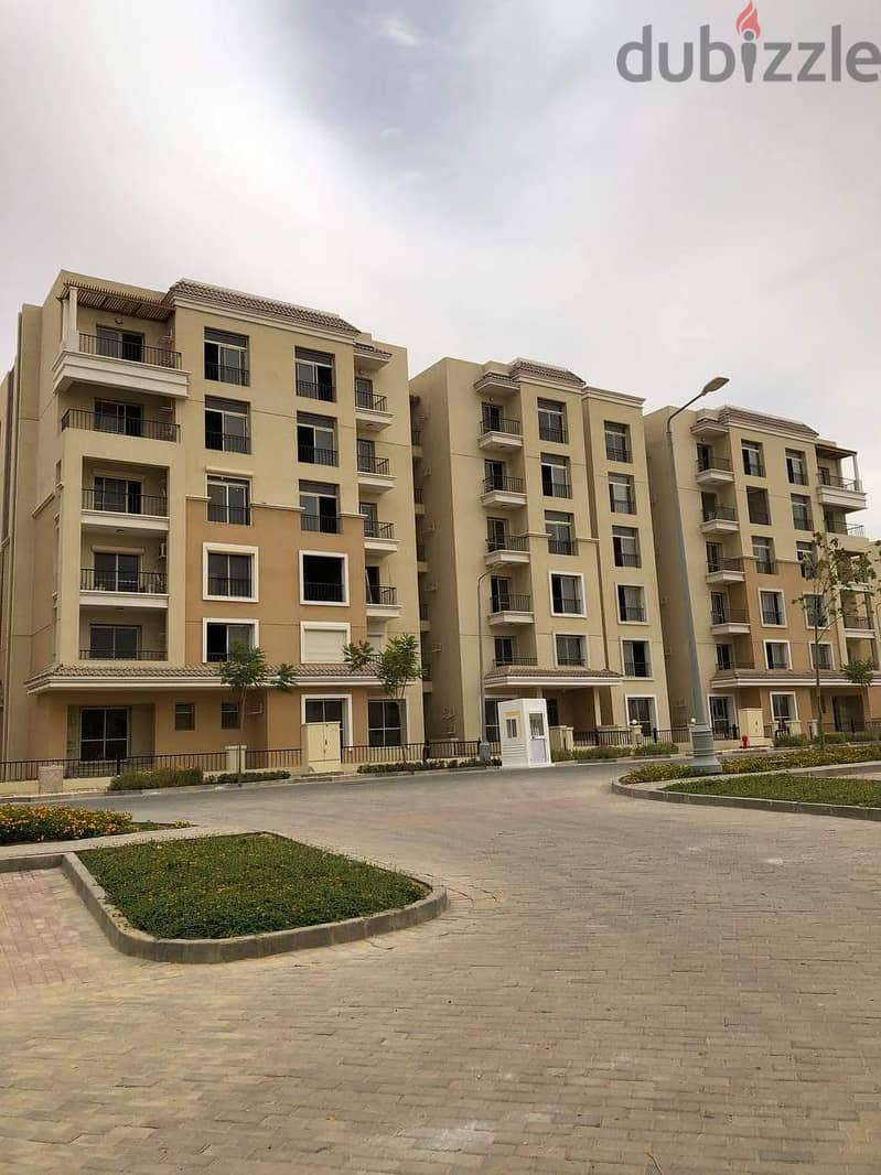 For sale, a 73 sqm studio with a 60 sqm garden, a distinctive division on a landscaped view, in Sarai Compound, New Cairo, with a down payment of 450 14