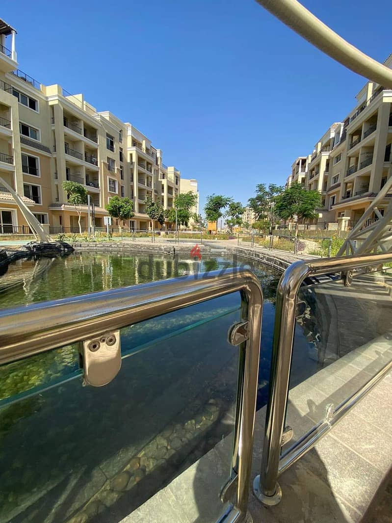 For sale, a 73 sqm studio with a 60 sqm garden, a distinctive division on a landscaped view, in Sarai Compound, New Cairo, with a down payment of 450 22
