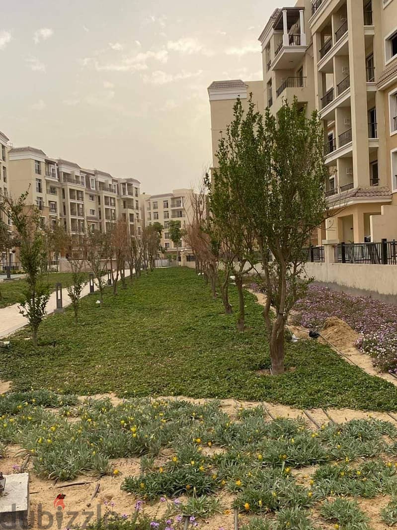 For sale, a 73 sqm studio with a 60 sqm garden, a distinctive division on a landscaped view, in Sarai Compound, New Cairo, with a down payment of 450 23