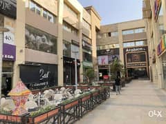 A commercial store for sale in installments, 152 square meters, first floor in Exit 14 Mall, in front of Greens Compound 0