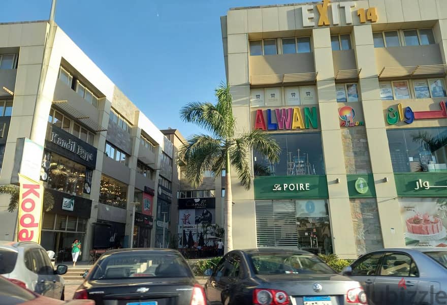 A commercial store for sale in installments, 152 square meters, first floor in Exit 14 Mall, in front of Greens Compound 2