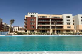 Ground floor apartment with 2 gardens overlooking a swimming pool at a special price