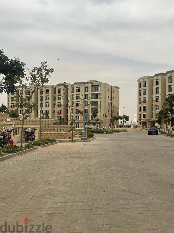 Apartment 130m with garden next to Madinaty in Sarai Compound للبيع شقه ارضي بجاردن علي طريق السويس بجوار مدينتي في كمبوند سراي 5