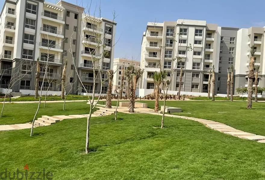 apartment for sale in Hyde park new cairo in front of AUC and Mivida over an open View with huge garden 4