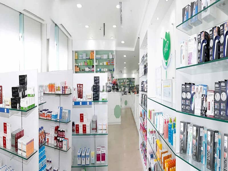 A pharmacy with a 30% discount in a medical building that serves 60 clinics and a radiology center in front of the entrance to Abdul Qader Fahmy Hospi 3