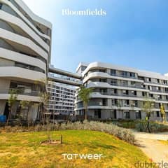 Own an apartment with a 76 sqm garden, close receipt in Bloomfields Compound in New Cairo