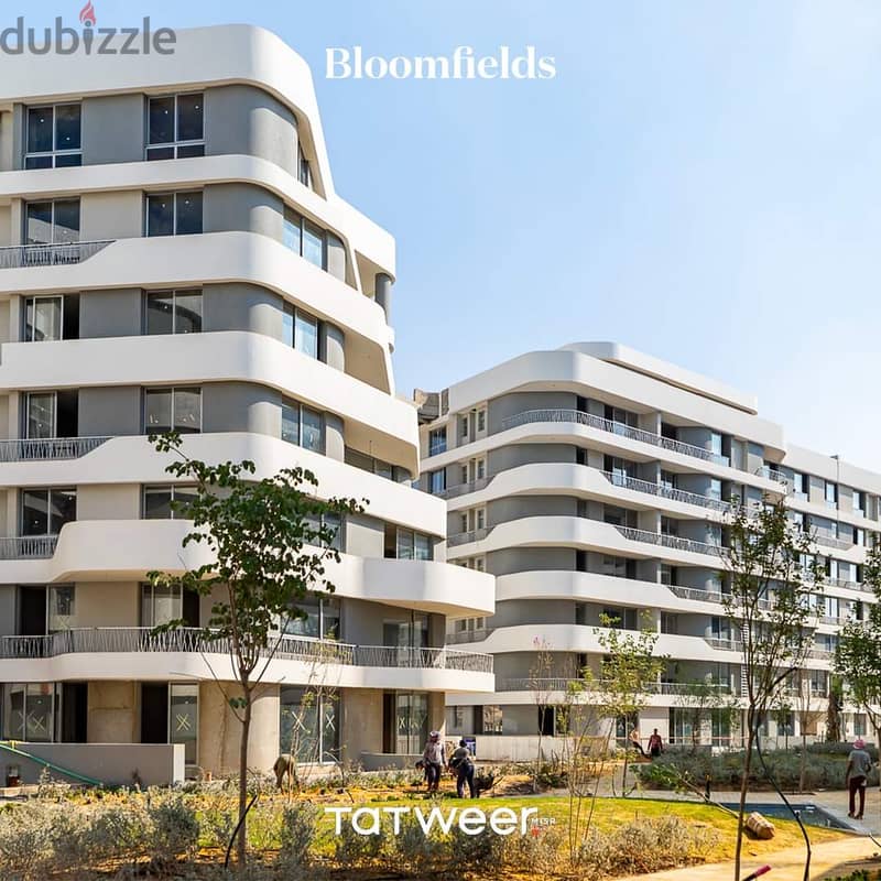 Own an apartment with a 76 sqm garden, close receipt in Bloomfields Compound in New Cairo 1