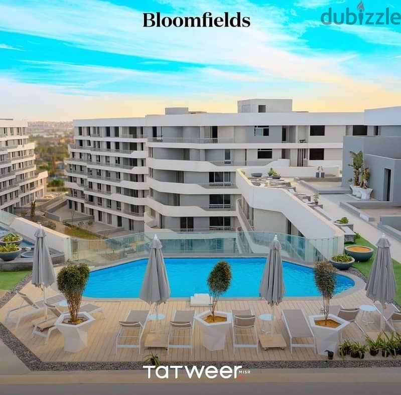 Own an apartment with a 76 sqm garden, close receipt in Bloomfields Compound in New Cairo 2