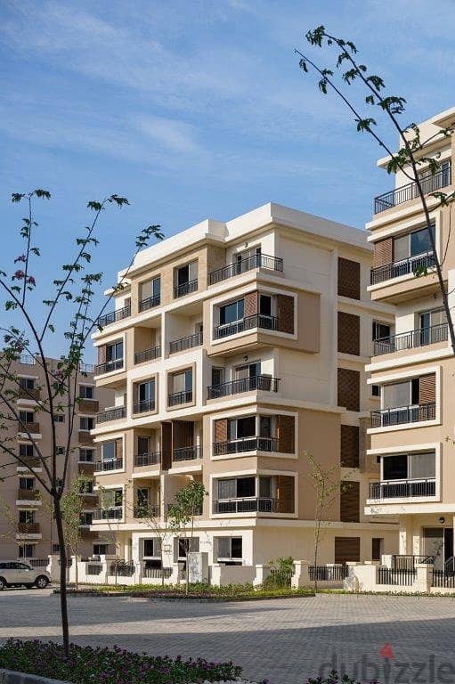 129 sqm apartment for sale, 39% discount, directly on Suez Road, near the cities of New Cairo and Taj City Compound 2