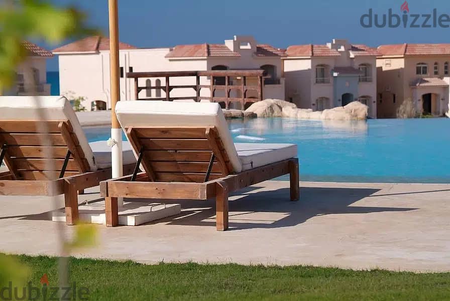 a fully finished lagoon view chalet for sale in | Telal El-Sokhna | before porto sokhna directly on the sea with a private garden with lagoon view 2