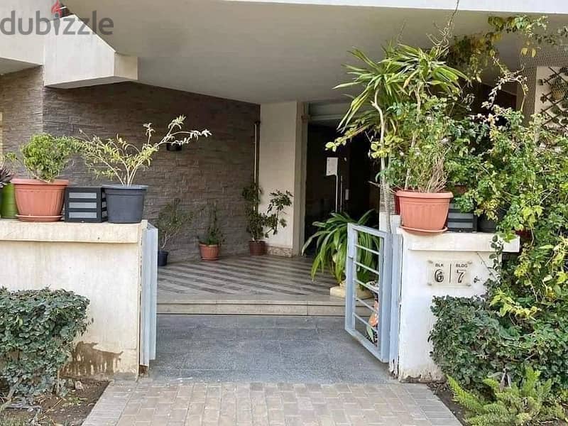 An apartment with a distinctive garden for sale in Taj City Compound in installments 1