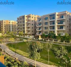 Apartment for sale, 111 meters, ground floor with garden, in Taj City phases 0
