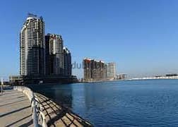 For sale, a super-luxe finishing hotel apartment, receipt nearby, charming view on El Alamein Towers on the North Coast, City Edge