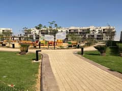 Resale apartment with private garden in October Plaza Compound in 6th of October
