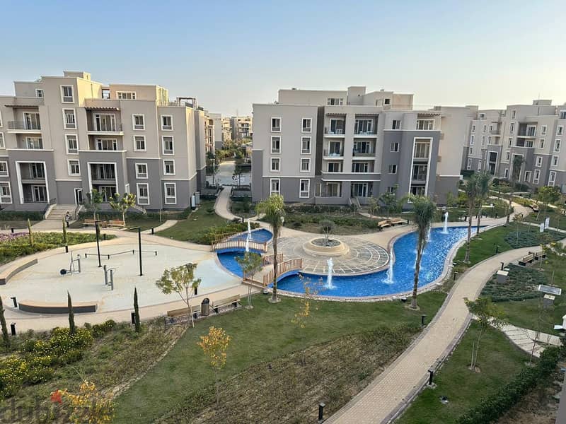 Resale apartment with private garden in October Plaza Compound in 6th of October 4