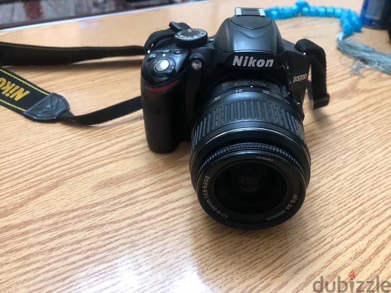 كاميرا nikon D3200 و عدسة ١٨:٥٥ و مستلزماتها 0