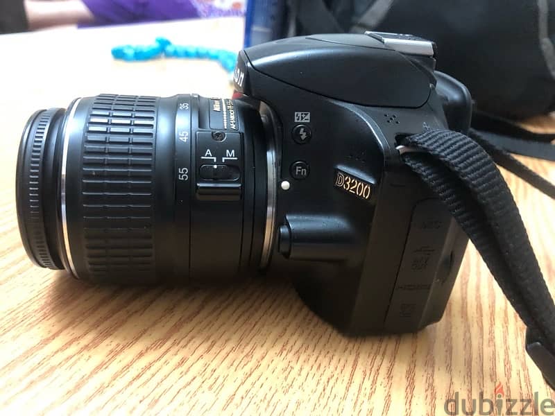 كاميرا nikon D3200 و عدسة ١٨:٥٥ و مستلزماتها 4