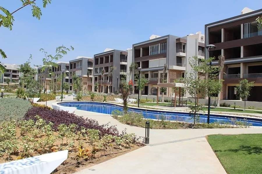 ميدتاون القاهرة الجديدة شقة للبيع الطابق الأرضي مباني 185م حديقة 50 م 1