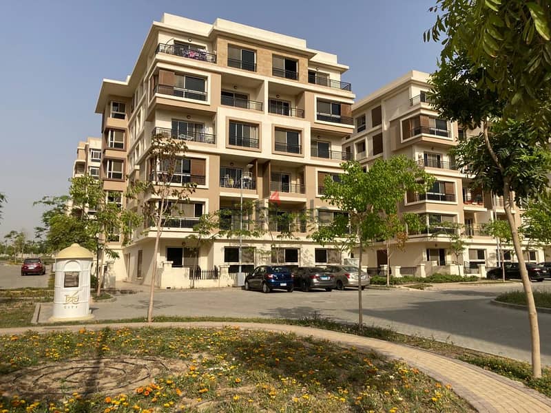 Apartment for sale 164 square meters directly on the Suez Road and next to the JW Marriott Hotel + 219 square meters garden in the Ta City compound 6