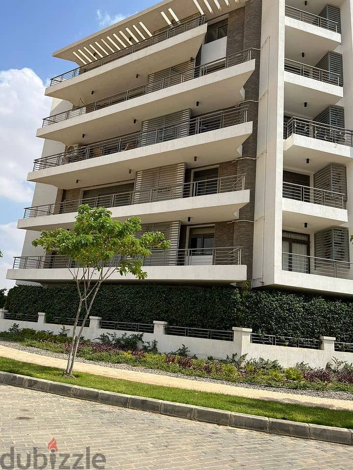 Apartment for sale 164 square meters directly on the Suez Road and next to the JW Marriott Hotel + 219 square meters garden in the Ta City compound 7