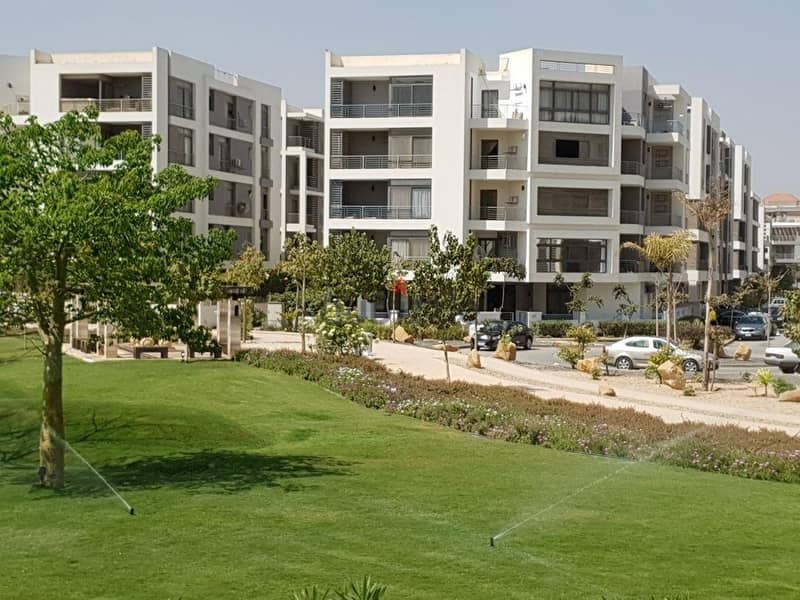 Apartment 114 m for sale in installments over the longest stopping period in the settlement in front of the international airport, Taj City Compound, 1